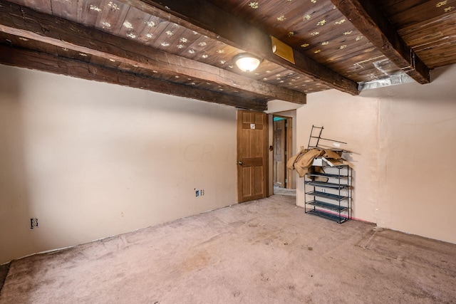 basement featuring carpet flooring and wooden ceiling