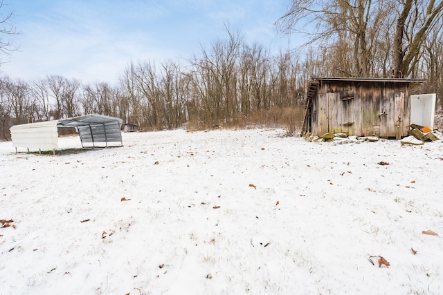 view of yard covered in snow