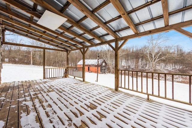 snow covered deck with an outdoor structure