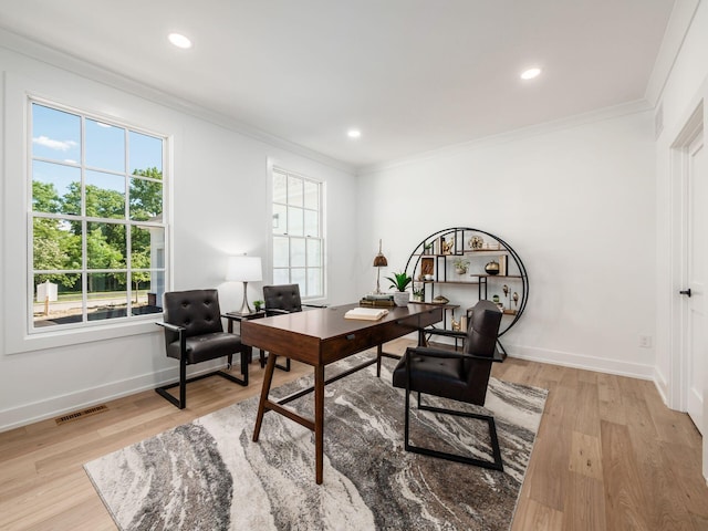 office space featuring crown molding and light wood-type flooring