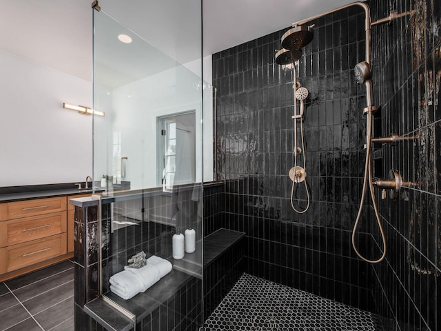 bathroom with tiled shower