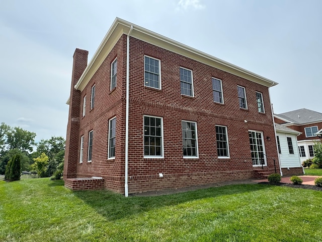 view of property exterior with a yard