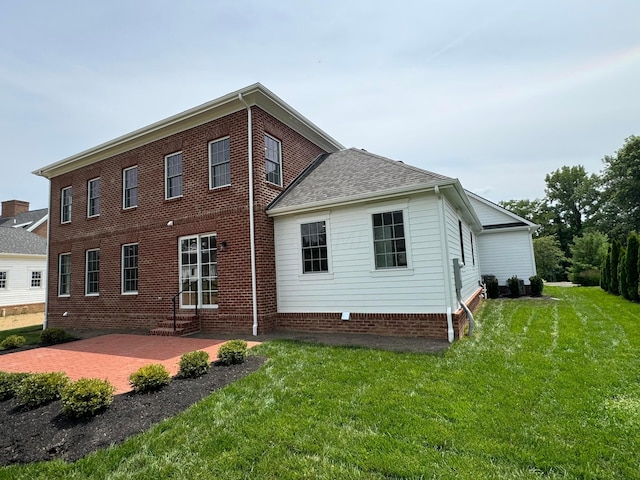 back of house featuring a yard and a patio