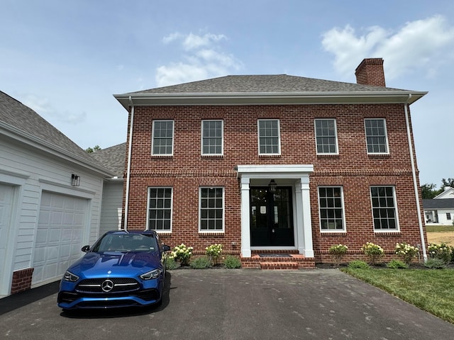 colonial home featuring a garage