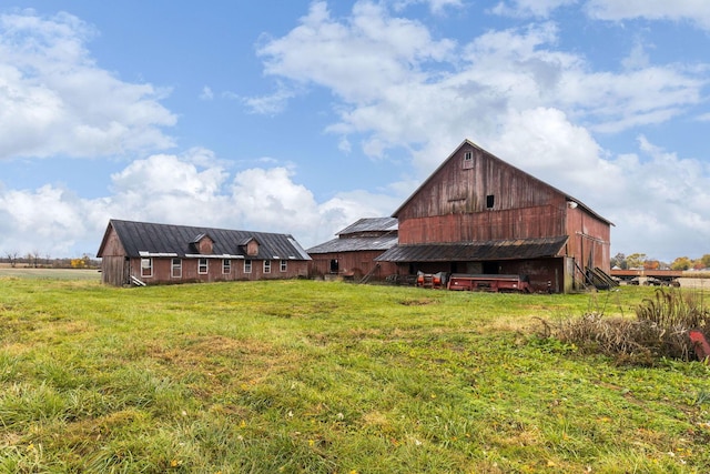 back of house with an outbuilding