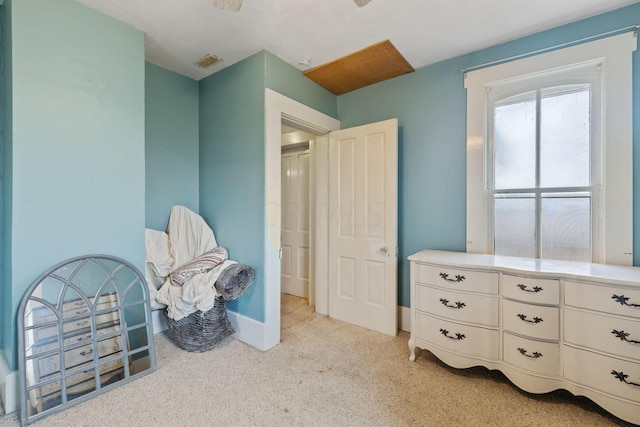 bedroom featuring light carpet