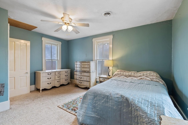 bedroom featuring light carpet and ceiling fan