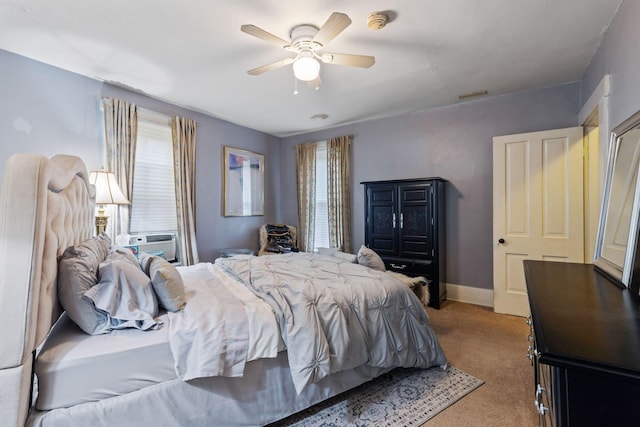 carpeted bedroom featuring ceiling fan and cooling unit