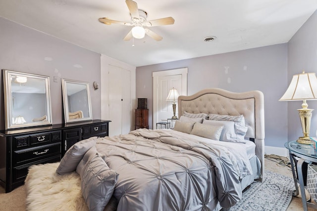 carpeted bedroom featuring ceiling fan