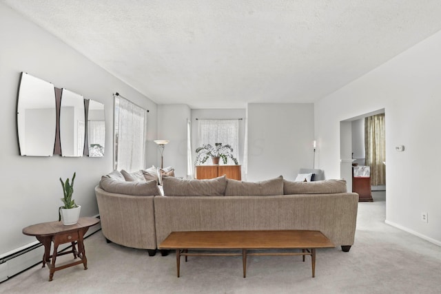 carpeted living room with a textured ceiling and a baseboard heating unit