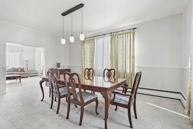 dining area featuring ornamental molding and light carpet