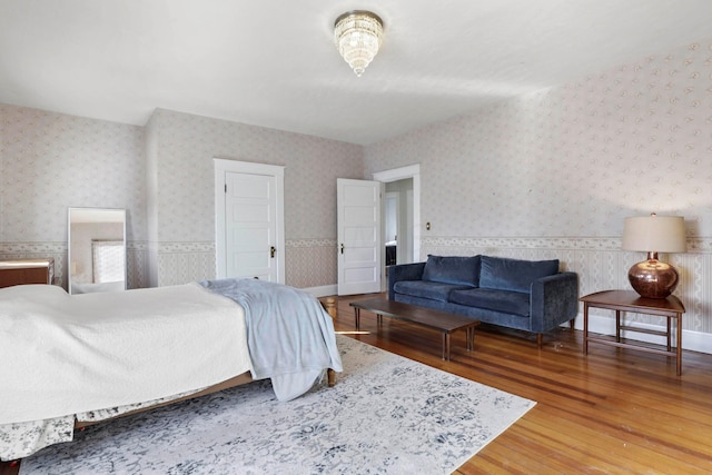 bedroom with hardwood / wood-style flooring