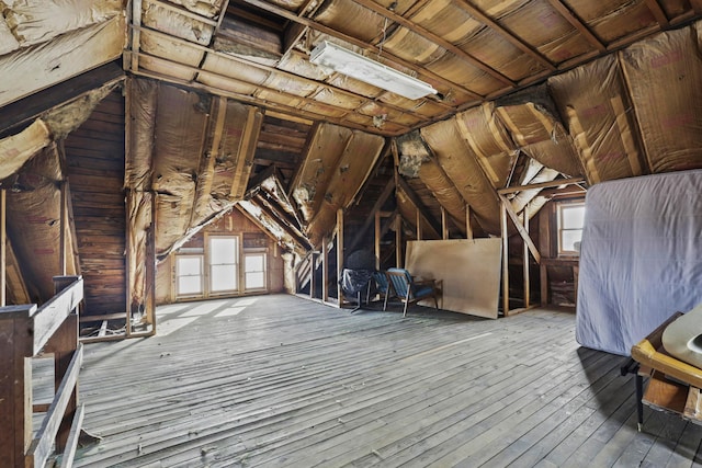 attic featuring a wealth of natural light