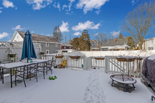 view of snow covered deck