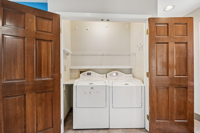 washroom featuring laundry area and separate washer and dryer