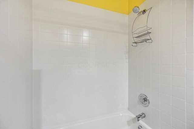 full bath featuring shower / bathtub combination