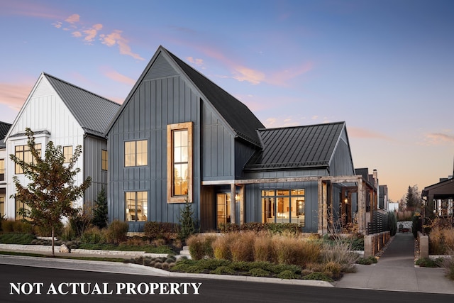 view of front of home featuring a standing seam roof, metal roof, and board and batten siding