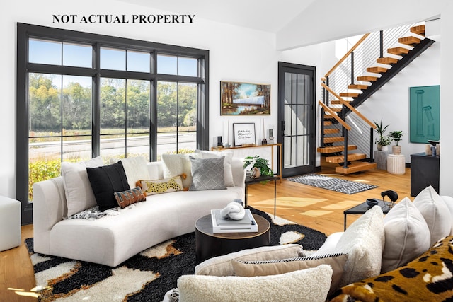 2835 Katmai Dr, Columbus, OH 43228 - living room with stairway, wood finished floors, and a wealth of natural light