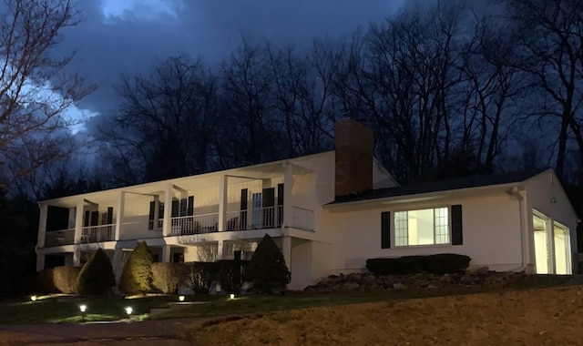 view of front of house featuring a balcony and a garage