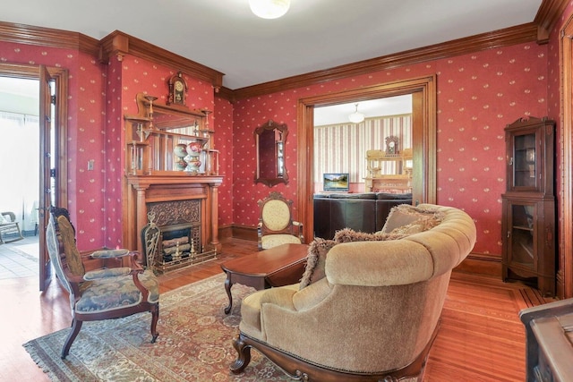 living room featuring wood-type flooring and crown molding