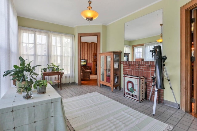 tiled entrance foyer with ornamental molding