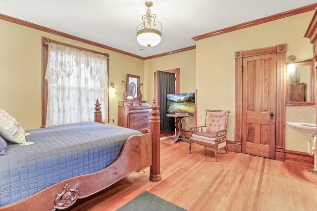 bedroom with hardwood / wood-style floors and crown molding