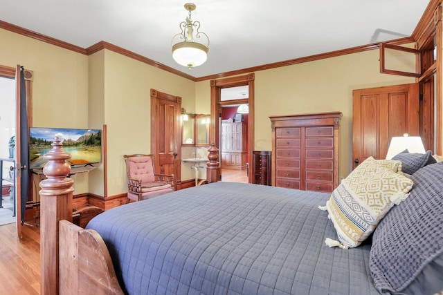 bedroom featuring light hardwood / wood-style flooring and ornamental molding