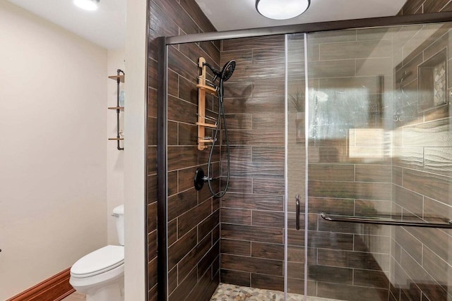 bathroom with walk in shower and toilet