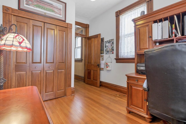 home office with light wood-type flooring