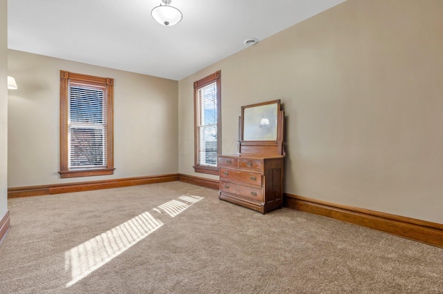 unfurnished bedroom with light carpet