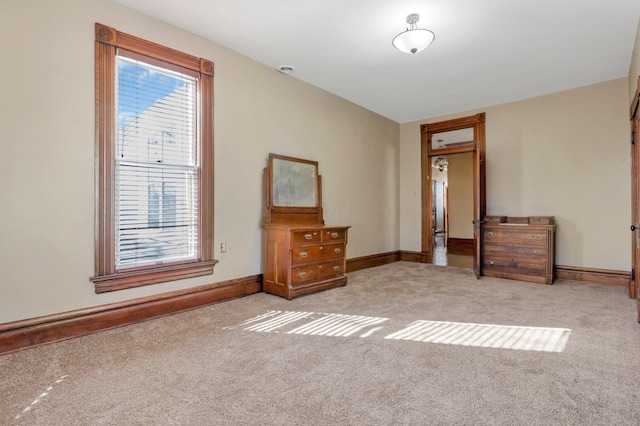 unfurnished bedroom featuring light colored carpet