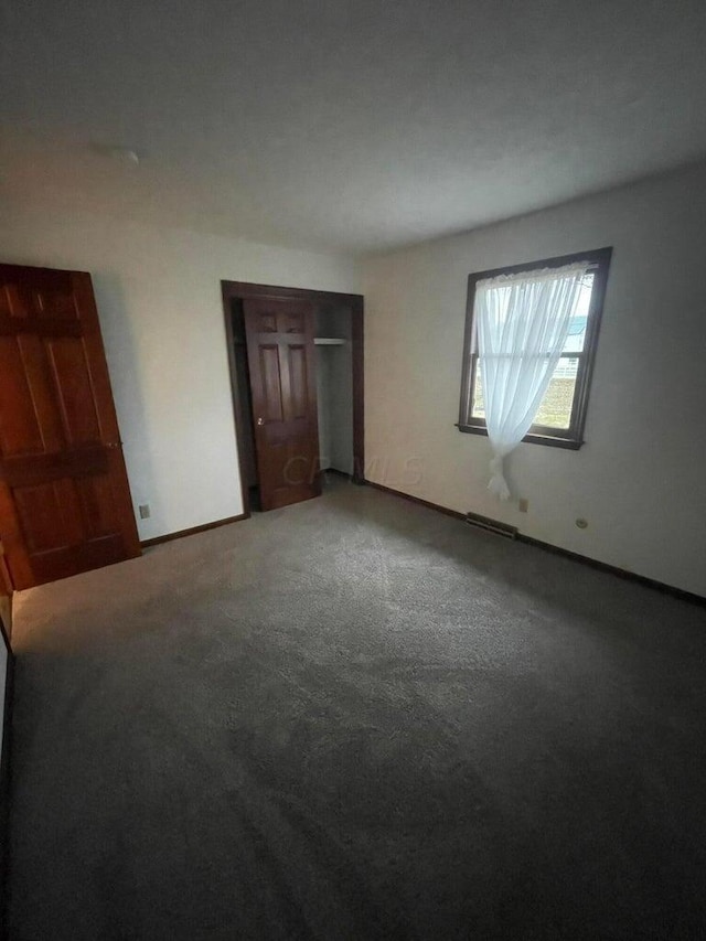 unfurnished bedroom featuring carpet flooring