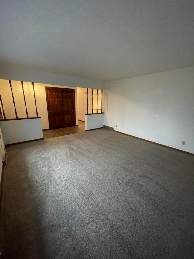 unfurnished living room featuring light carpet