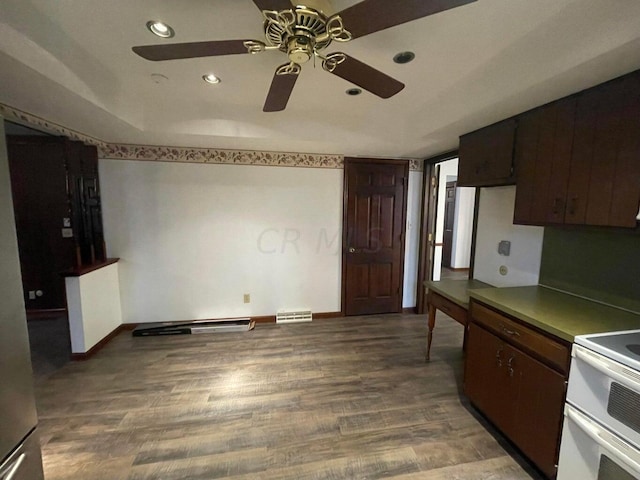 kitchen with hardwood / wood-style floors, ceiling fan, white electric range oven, and dark brown cabinetry