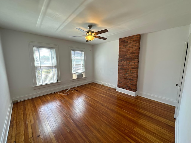 unfurnished room featuring hardwood / wood-style flooring, ceiling fan, and cooling unit