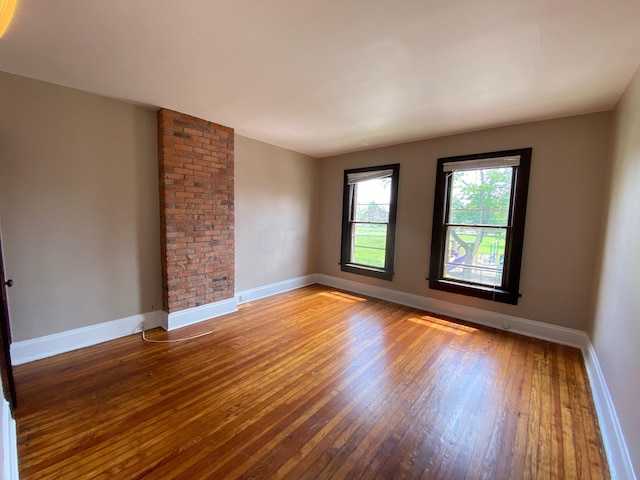 unfurnished room featuring wood-type flooring