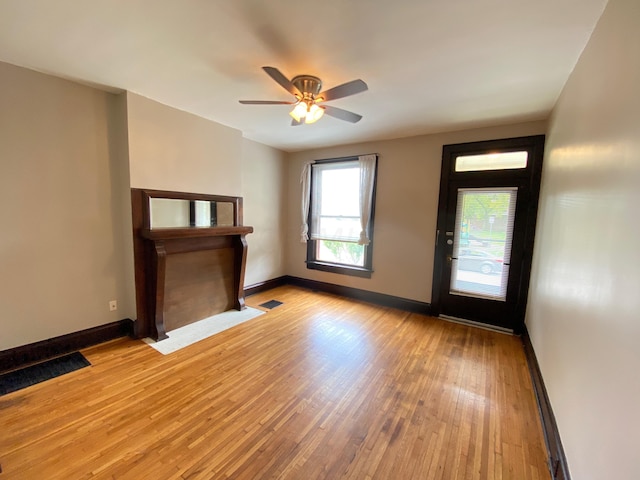 entrance foyer with ceiling fan and light hardwood / wood-style floors