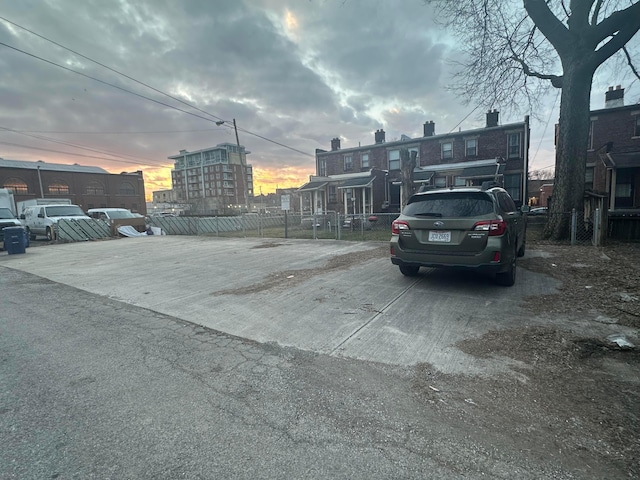 view of parking at dusk