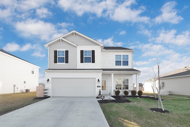 view of property with a front lawn, central AC unit, and a garage