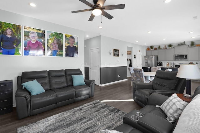 living room featuring dark hardwood / wood-style floors and ceiling fan