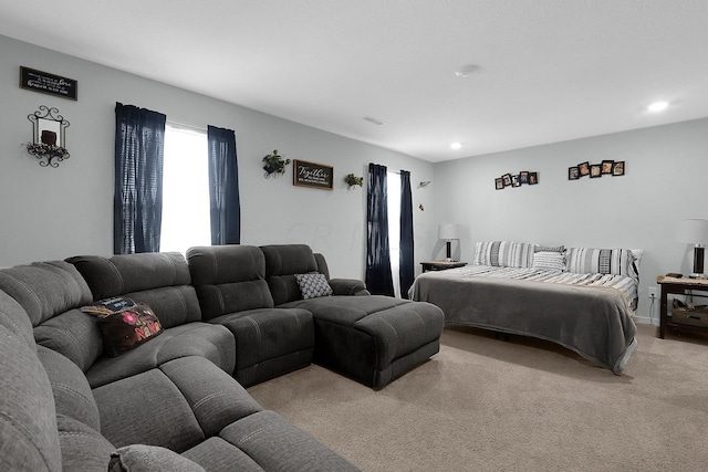 bedroom featuring light carpet