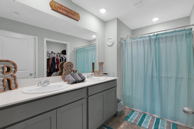 bathroom with vanity and curtained shower