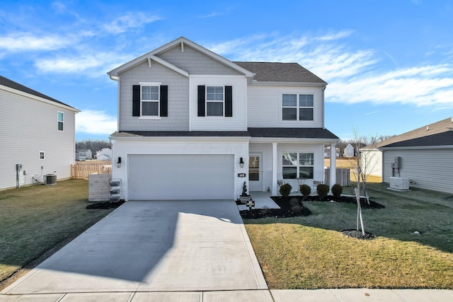 front facade featuring a front lawn, central AC unit, and a garage