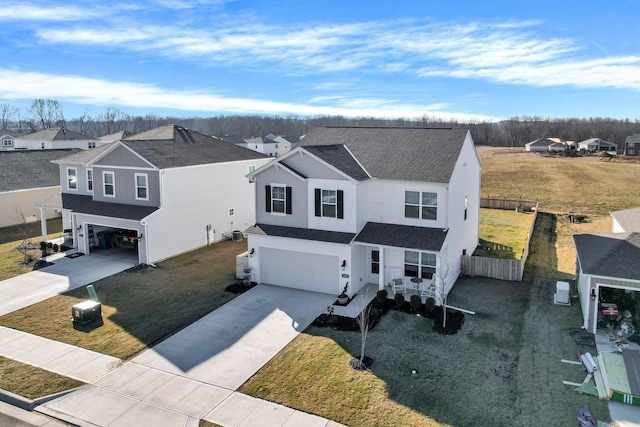 view of front of house with a front yard and a garage