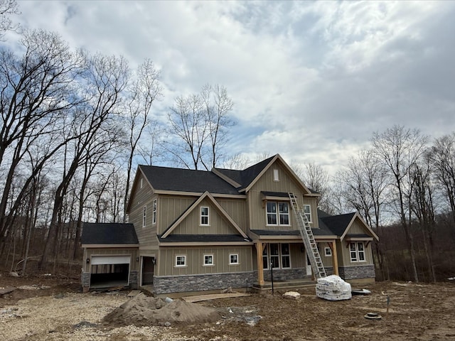 craftsman-style house with stone siding