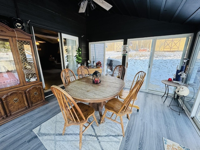 sunroom featuring ceiling fan and vaulted ceiling