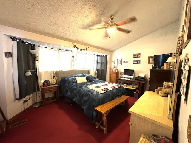 carpeted bedroom with a textured ceiling, ceiling fan, and lofted ceiling