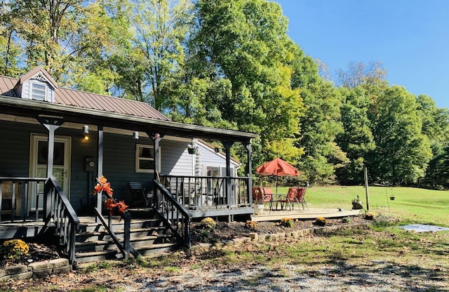 exterior space with a lawn and covered porch