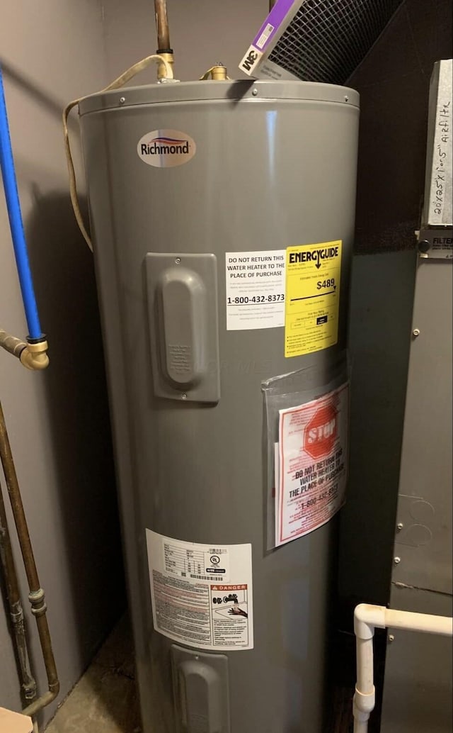 utility room featuring electric water heater