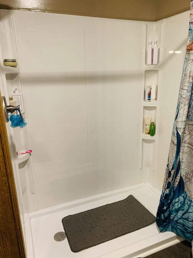 bathroom with a shower with curtain